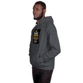 Unisex pullover hoodie in dark gray with hood and front pocket, graphic chest patch