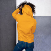 Mustard yellow unisex hoodie shown from back, with hood and full-length sleeves.
