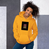 Unisex hoodie in gold with hood and kangaroo pocket, graphic logo patch on chest.