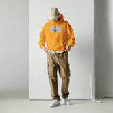 Unisex gold hoodie with hood and front kangaroo pocket