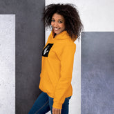 Mustard yellow unisex hoodie with hood and black graphic chest patch