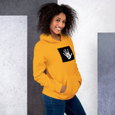 Mustard yellow unisex hoodie with hood, kangaroo pocket, and black graphic patch