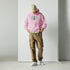 Unisex hoodie in light pink, front graphic and kangaroo pocket, adjustable hood.
