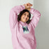 Light pink unisex hoodie with front pouch pocket and adjustable drawstring hood