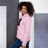 Unisex light pink hoodie side view with pullover hood and front graphic patch