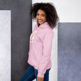 Light pink unisex hoodie with hood and chest mama bear graphic, side view