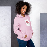 Light pink unisex hoodie three-quarter view with chest heart graphic and pocket
