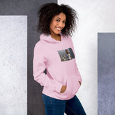 Light pink pullover hoodie with hood and front pocket, featuring a chest photo graphic.