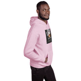 Pink pullover hoodie with hood and front graphic patch, shown from the side