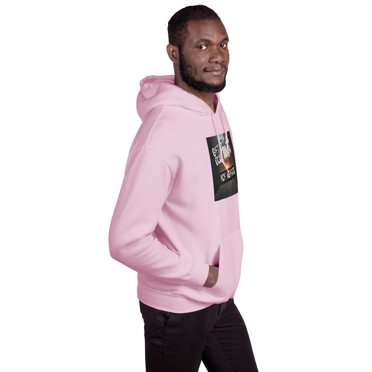 Pink pullover hoodie with hood and front graphic patch, shown from the side