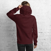 Maroon unisex pullover hoodie with hood and front pocket, shown from the back