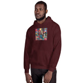Maroon unisex pullover hoodie with hood, chest graphic print, front three-quarter view.