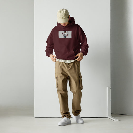 Maroon unisex pullover hoodie with front pouch and chest graphic print, hood up