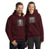 Unisex hoodie in maroon with front logo graphic, pullover hood, and kangaroo pocket