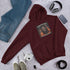 Unisex hoodie in Maroon with pullover hood and front chest graphic print