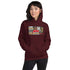 Maroon pullover hoodie with front graphic print, kangaroo pocket, and drawstring hood.