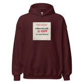 Maroon pullover hoodie with hood, kangaroo pocket, and chest graphic