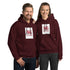 Maroon pullover hoodie with hood and front pocket, square chest graphic print.