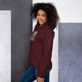 Unisex maroon hoodie with “Ice Agents” graphic patch on the left sleeve