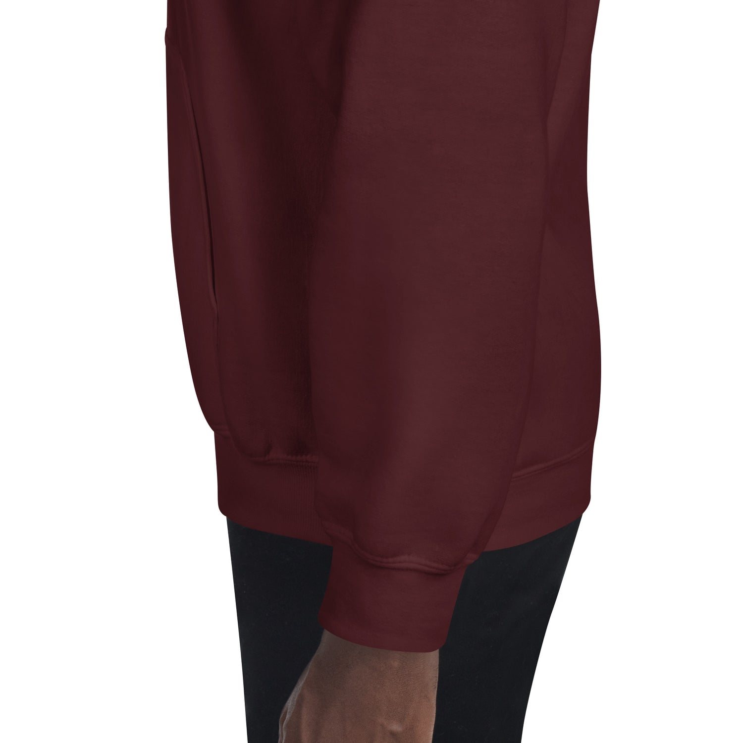 Maroon hoodie close-up of lower front hem and sleeve cuff