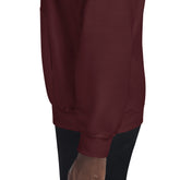 Burgundy hoodie sleeve and hem close-up with ribbed cuffs