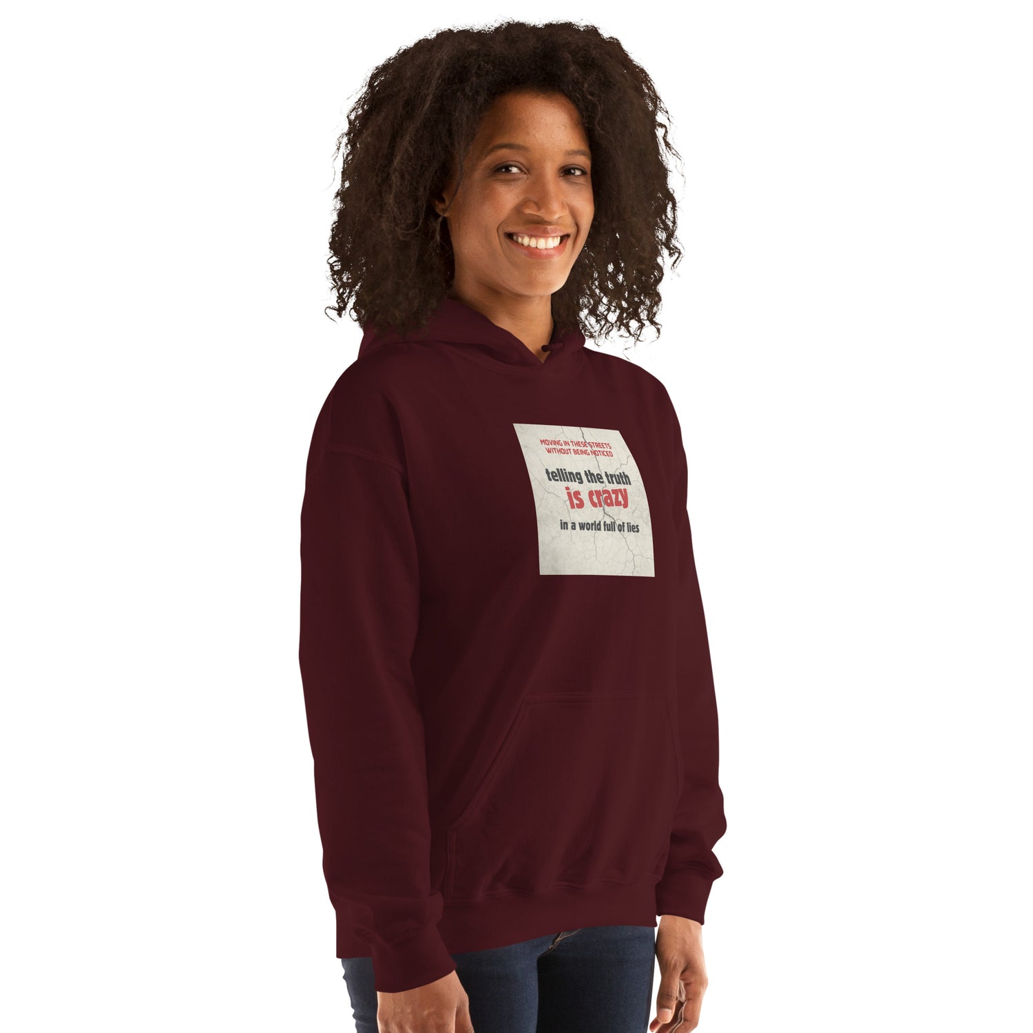 Maroon unisex hoodie with hood and chest logo patch, front three-quarter view