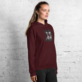 Unisex maroon hoodie, chest graphic visible on front with kangaroo pocket