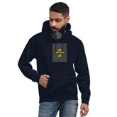 Navy unisex hoodie with hood, front pouch pocket, and small chest graphic patch.