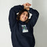 Navy unisex hoodie with chest graphic, hood with drawstrings, and front pouch pocket