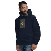 Navy unisex hoodie with hood, front pouch pocket, and small chest graphic patch.