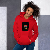 Unisex red pullover hoodie with hood, kangaroo pocket, and front graphic patch (front view)