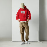 Red unisex pullover hoodie with front pouch and chest graphic print, hood up