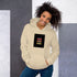 Unisex hoodie in off-white with hood and kangaroo pocket, graphic logo patch on chest.