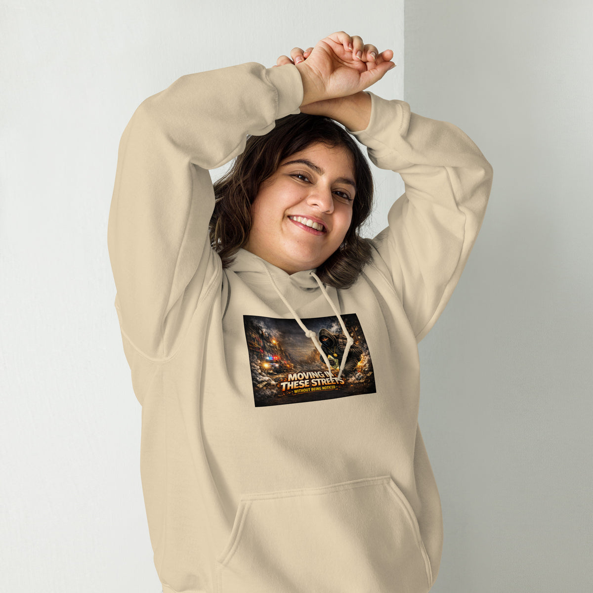 Tan streetwear hoodie with hood, front pocket, and chest graphic print