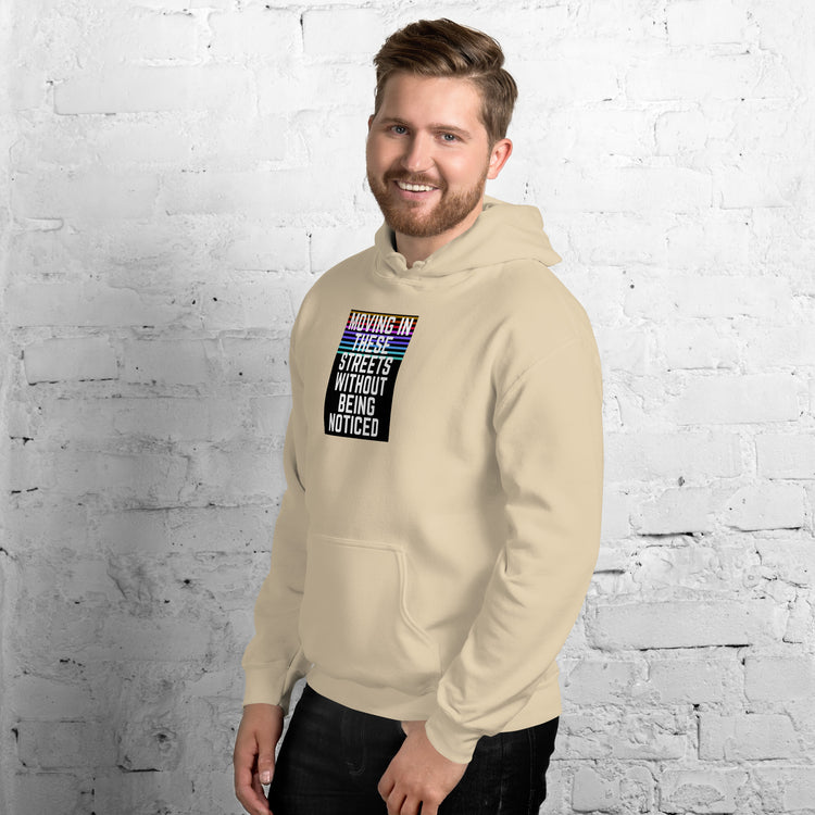 Unisex cream pullover hoodie with front graphic and kangaroo pocket.
