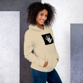 Cream unisex hoodie with hood, kangaroo pocket, and black graphic patch