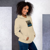 Cream/off-white unisex hoodie with front hood, pouch pocket, and chest logo graphic