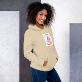 Cream unisex hoodie with hood, front pouch pocket, and chest graphic patch.
