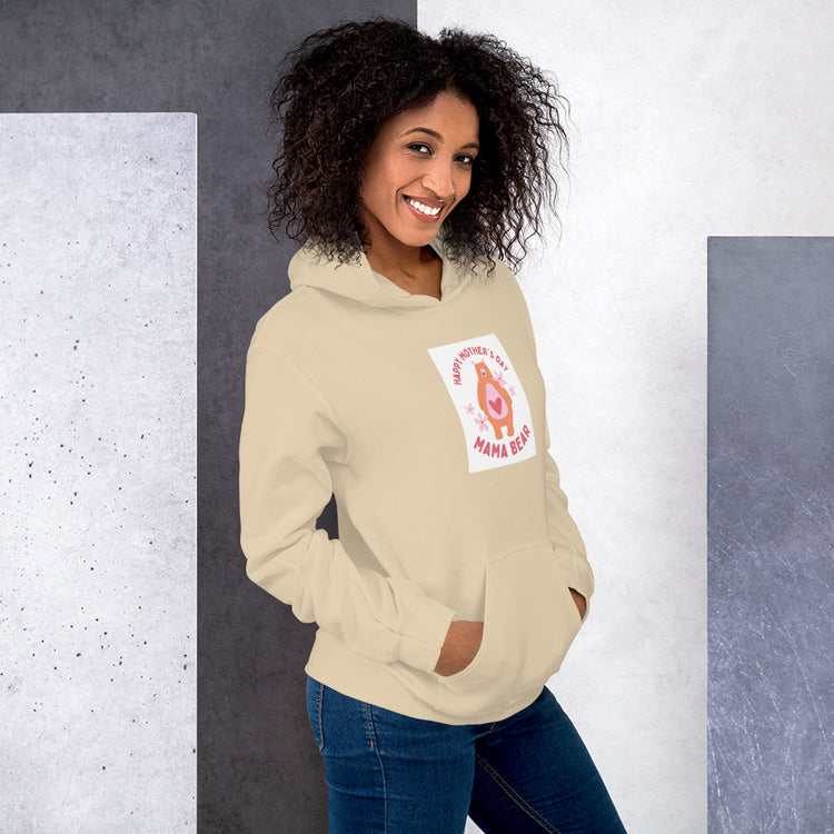 Cream unisex hoodie with hood, front pouch pocket, and chest graphic patch.