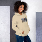 Light beige pullover hoodie with hood and front photo graphic, front three-quarter view
