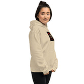Unisex hoodie in light beige, front-side view showing chest graphic and pocket