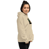 Light cream unisex hoodie close-up of chest graphic and sleeve pocket seam