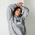 Ash grey unisex hoodie with chest graphic, hood with drawstrings, and front pouch pocket