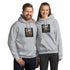 Unisex hoodie in light gray with front logo graphic, pullover hood, and kangaroo pocket
