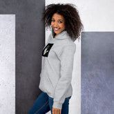 Light gray unisex hoodie with hood and black graphic chest patch