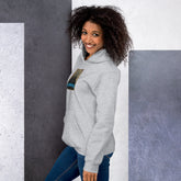 Unisex hoodie in light gray with hood, pouch pocket, and small sleeve graphic