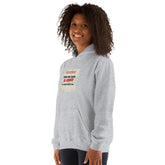 Light gray hoodie with hood and front graphic print, front 3/4 view.