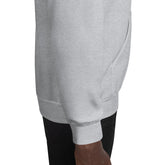 Heather gray unisex hoodie side view with drawstring-free hood and ribbed sleeve cuff
