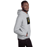 Heather gray unisex hoodie with hood, front pouch pocket, and chest graphic patch